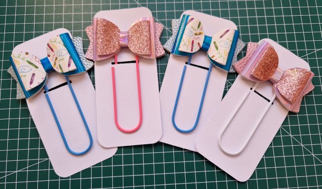 large paperclip with faux leather bow